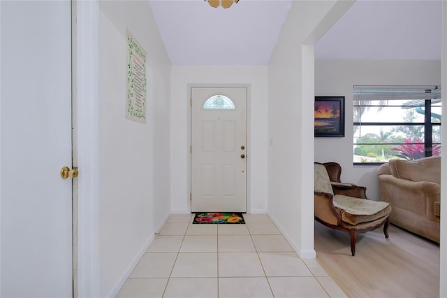 990 Sea Fox Rd, Venice, FL 34293 - foyer entrance with light tile patterned floors and baseboards