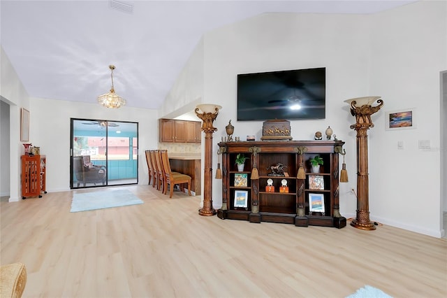 990 Sea Fox Rd, Venice, FL 34293 - living area with light wood-style floors, baseboards, lofted ceiling, and visible vents