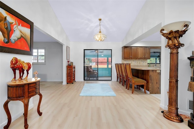 990 Sea Fox Rd, Venice, FL 34293 - entrance foyer featuring light wood-type flooring, baseboards, and vaulted ceiling
