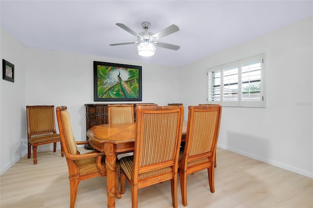 990 Sea Fox Rd, Venice, FL 34293 - dining space with light wood finished floors, baseboards, and a ceiling fan