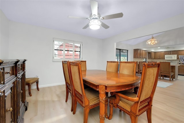 990 Sea Fox Rd, Venice, FL 34293 - dining area featuring ceiling fan, light wood-type flooring, and baseboards
