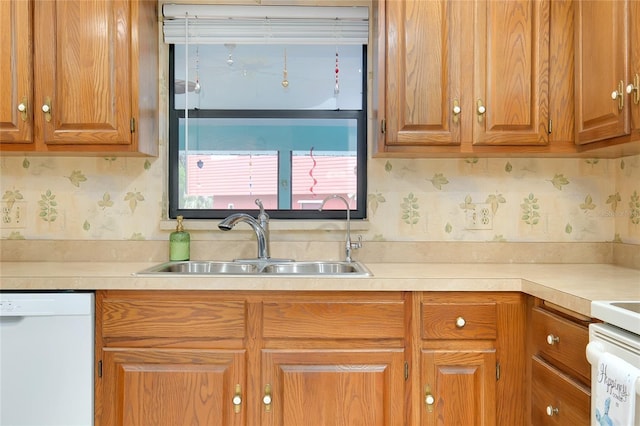 990 Sea Fox Rd, Venice, FL 34293 - kitchen with a sink, light countertops, dishwasher, and wallpapered walls