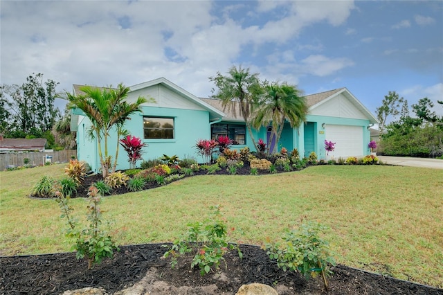 990 Sea Fox Rd, Venice, FL 34293 - single story home with an attached garage, fence, stucco siding, a front lawn, and driveway