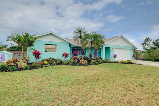 990 Sea Fox Rd, Venice, FL 34293 - single story home featuring a front lawn, a garage, driveway, and stucco siding