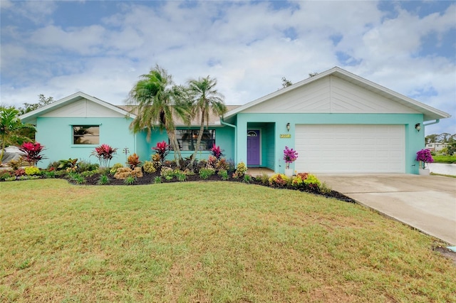 990 Sea Fox Rd, Venice, FL 34293 - ranch-style home featuring a front yard, an attached garage, stucco siding, and concrete driveway