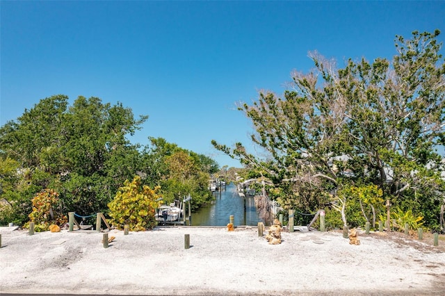 property view of water featuring a dock