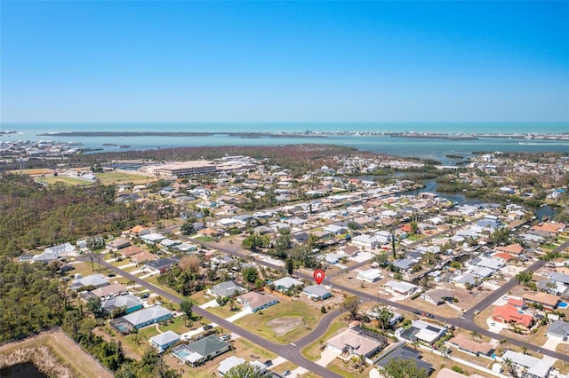 aerial view featuring a water view and a residential view