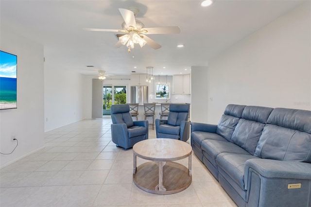 living room featuring recessed lighting, light tile patterned floors, and a ceiling fan