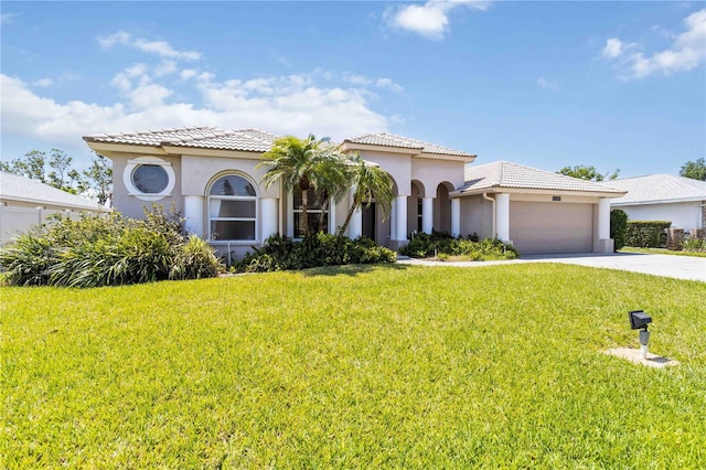 201 Bayside Ct, Nokomis, FL 34275 - mediterranean / spanish home with an attached garage, a front lawn, driveway, and stucco siding