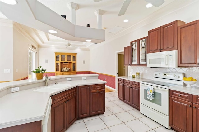 201 Bayside Ct, Nokomis, FL 34275 - kitchen with a sink, a ceiling fan, white appliances, crown molding, and light countertops