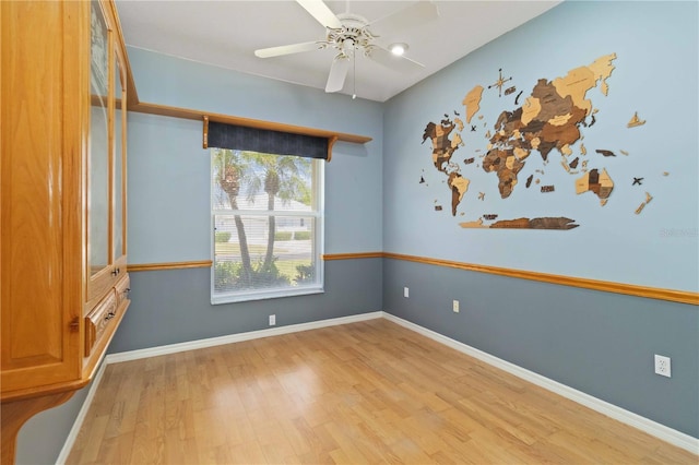 201 Bayside Ct, Nokomis, FL 34275 - spare room with baseboards, a ceiling fan, and wood finished floors