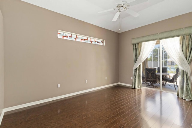 201 Bayside Ct, Nokomis, FL 34275 - empty room with dark wood finished floors, baseboards, and ceiling fan
