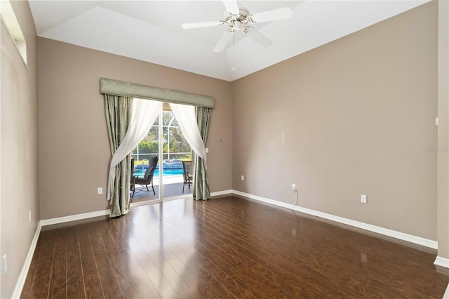 201 Bayside Ct, Nokomis, FL 34275 - empty room with baseboards, a ceiling fan, and dark wood-style floors