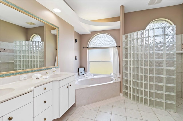 201 Bayside Ct, Nokomis, FL 34275 - bathroom with a sink, double vanity, visible vents, a garden tub, and a walk in shower