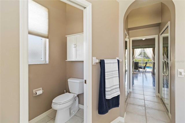 201 Bayside Ct, Nokomis, FL 34275 - bathroom featuring tile patterned floors, baseboards, and toilet