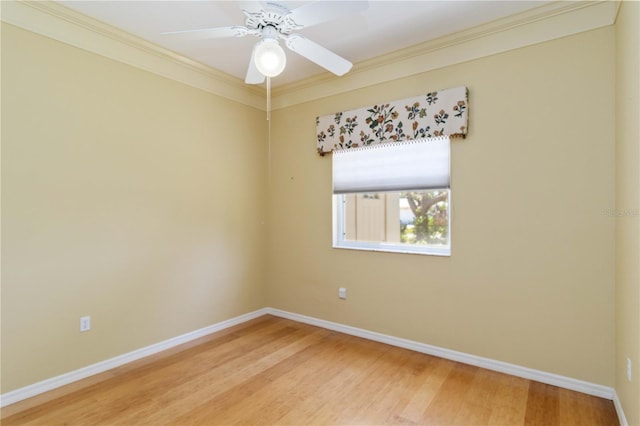 201 Bayside Ct, Nokomis, FL 34275 - unfurnished room with a ceiling fan, baseboards, ornamental molding, and light wood-style flooring