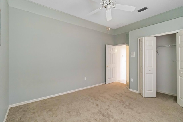201 Bayside Ct, Nokomis, FL 34275 - unfurnished bedroom featuring visible vents, a closet, baseboards, light colored carpet, and ceiling fan