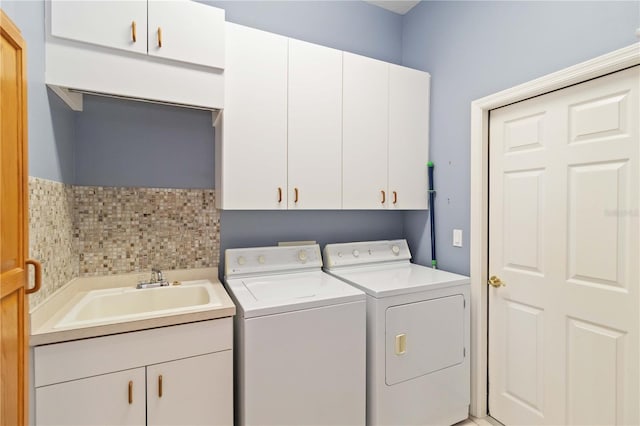 201 Bayside Ct, Nokomis, FL 34275 - washroom with cabinet space, washing machine and clothes dryer, and a sink