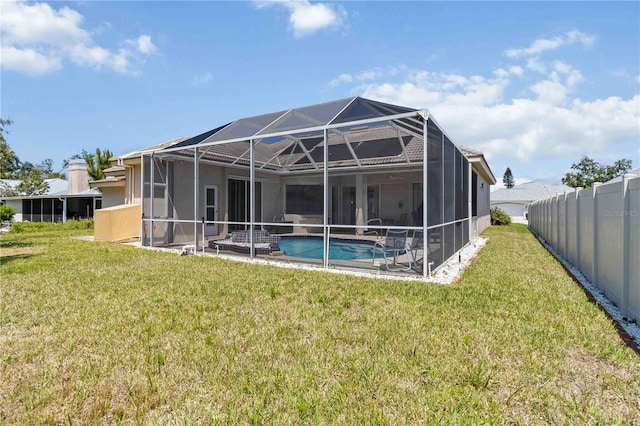 201 Bayside Ct, Nokomis, FL 34275 - back of house featuring stucco siding, fence, an outdoor pool, and a yard
