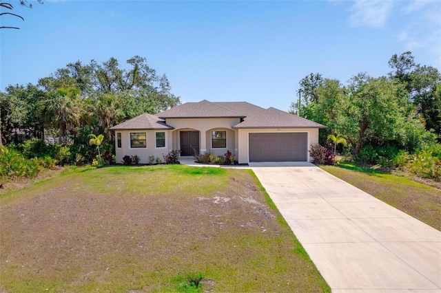 view of front of house featuring concrete driveway, a front lawn, a garage, and stucco siding