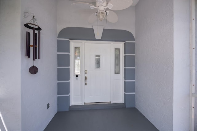 property entrance with stucco siding