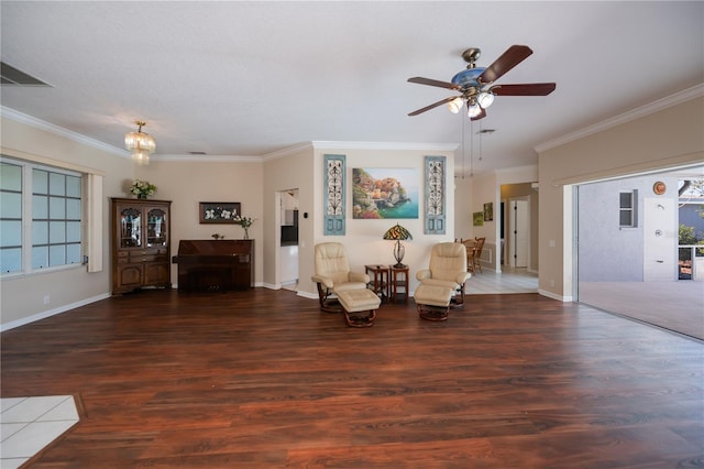 living area featuring ornamental molding, a ceiling fan, and wood finished floors
