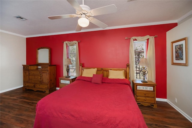 bedroom featuring multiple windows, ornamental molding, wood finished floors, and visible vents