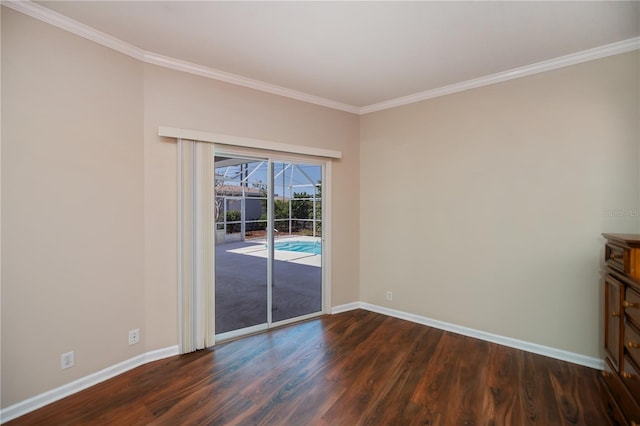 unfurnished room with crown molding, dark wood-style flooring, and baseboards
