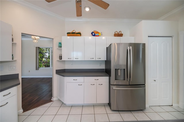 kitchen with white cabinets, dark countertops, open shelves, stainless steel refrigerator with ice dispenser, and ornamental molding