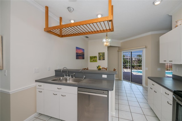 kitchen with ornamental molding, a peninsula, dark countertops, a sink, and stainless steel appliances