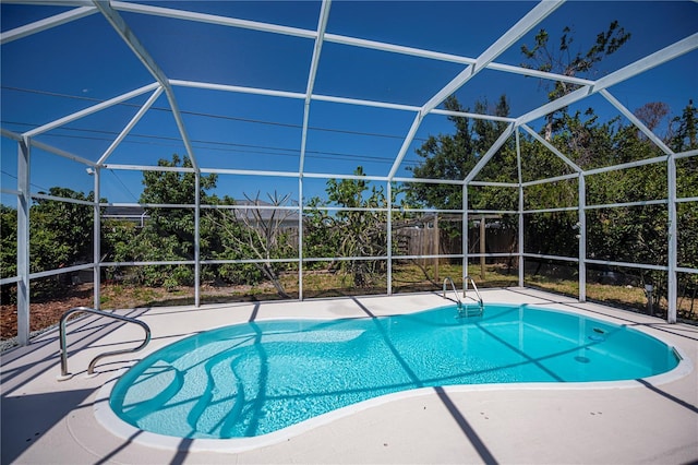 outdoor pool with a patio and a lanai