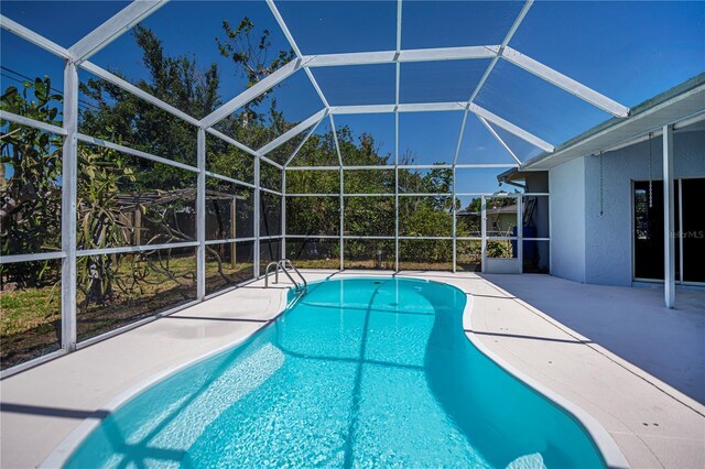 pool featuring a patio area and a lanai