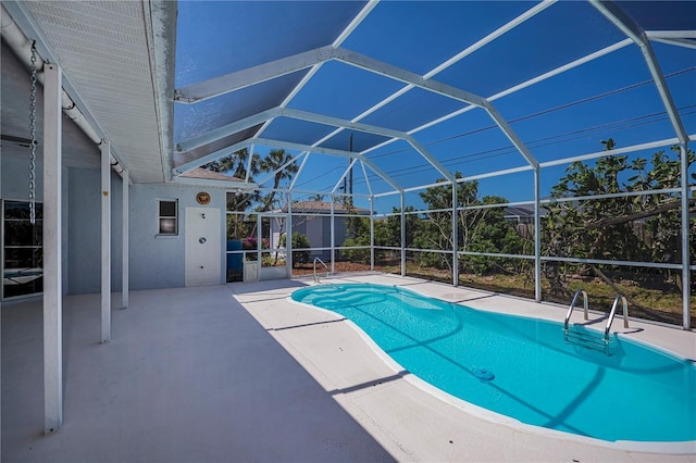 pool with a patio and a lanai
