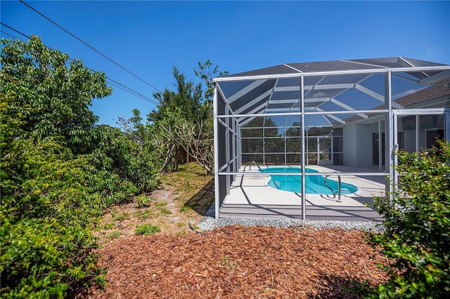 pool featuring a patio area and a lanai