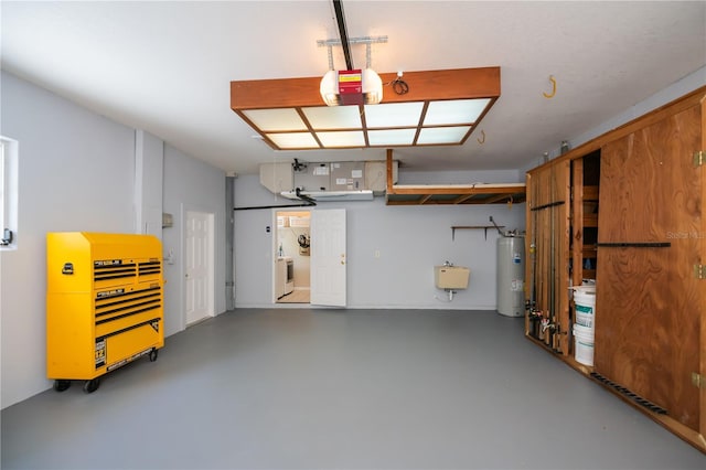 garage featuring a sink, heating unit, a garage door opener, and electric water heater