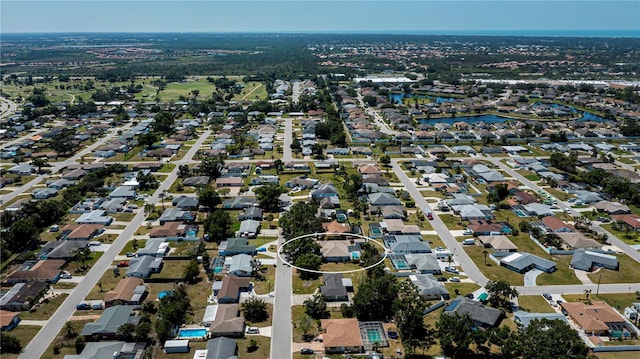 aerial view featuring a water view and a residential view