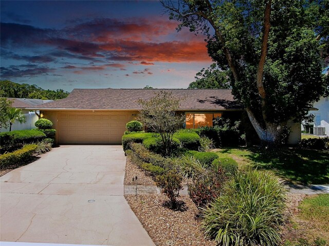 810 Anchorage Ln, Palm Harbor, FL 34685 - view of front of house with a garage and driveway