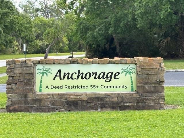 810 Anchorage Ln, Palm Harbor, FL 34685 - community sign with a yard