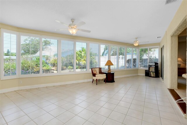 810 Anchorage Ln, Palm Harbor, FL 34685 - sunroom / solarium with tile patterned flooring and baseboards