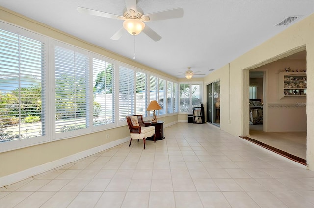 810 Anchorage Ln, Palm Harbor, FL 34685 - sunroom featuring baseboards
