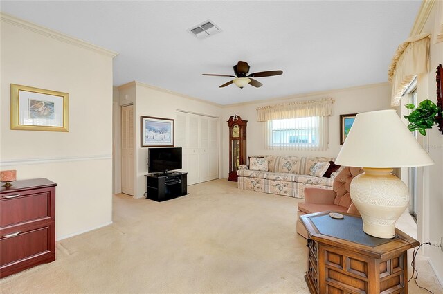 810 Anchorage Ln, Palm Harbor, FL 34685 - living room with ceiling fan, light colored carpet, and ornamental molding