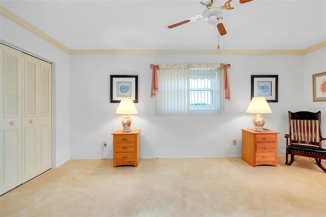 810 Anchorage Ln, Palm Harbor, FL 34685 - sitting room with carpet flooring, a ceiling fan, crown molding, and baseboards