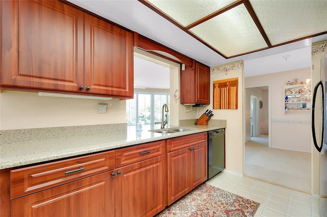 810 Anchorage Ln, Palm Harbor, FL 34685 - kitchen featuring black dishwasher, a sink, brown cabinets, and light stone countertops