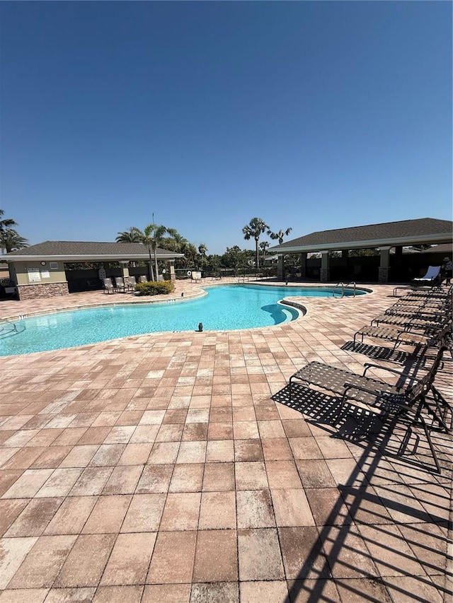 pool with a patio area