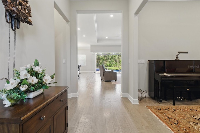 interior space featuring baseboards, light wood-type flooring, and recessed lighting