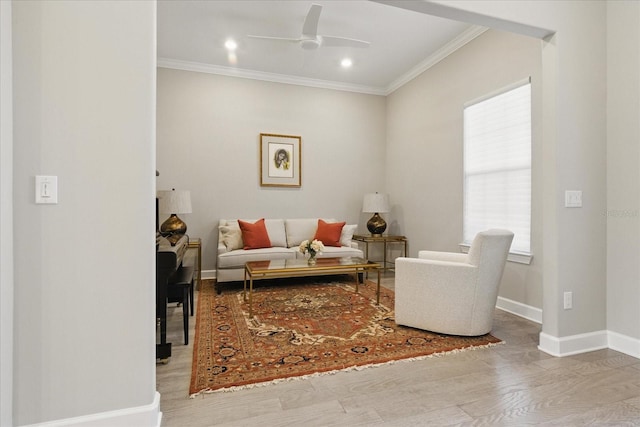 living area with baseboards, recessed lighting, crown molding, ceiling fan, and wood finished floors