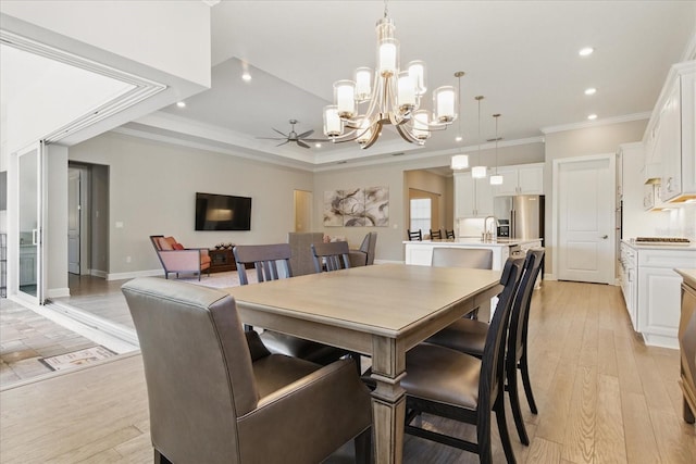 dining space with recessed lighting, light wood-style floors, and ornamental molding