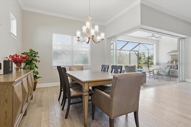 dining space with light wood-style flooring, baseboards, ornamental molding, and a wealth of natural light