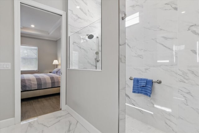 full bathroom featuring ensuite bathroom, ornamental molding, marble finish floor, a marble finish shower, and baseboards