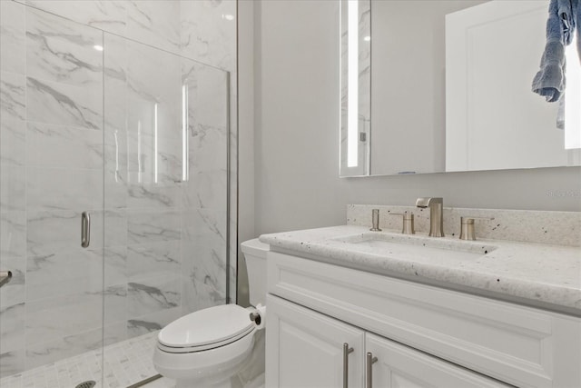 full bath featuring toilet, a marble finish shower, and vanity